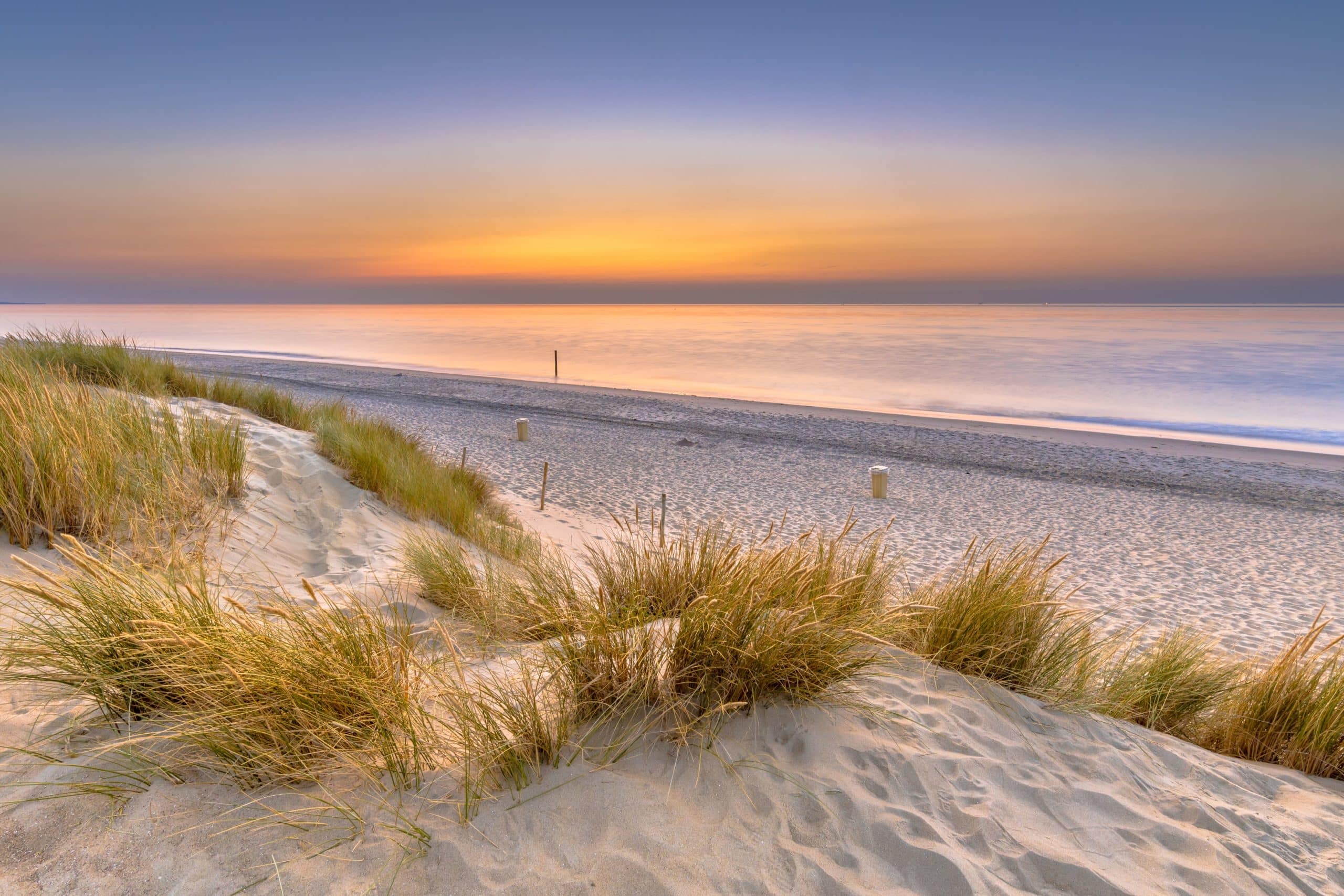 sunset-view-over-ocean-from-dune-in-zeeland-XF28FQZ-min